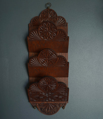 Wooden mail holder with hand-carved intricate carvings and two metal hooks