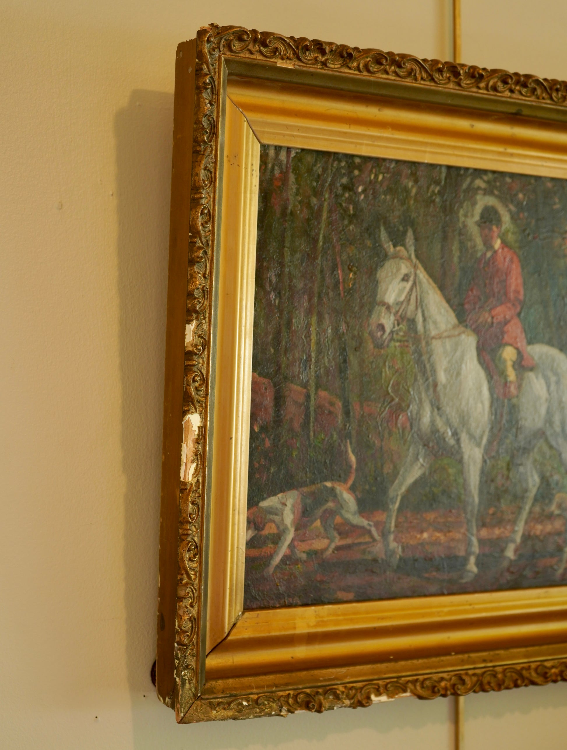 Oil painting of a person on a white horse in a gold frame.